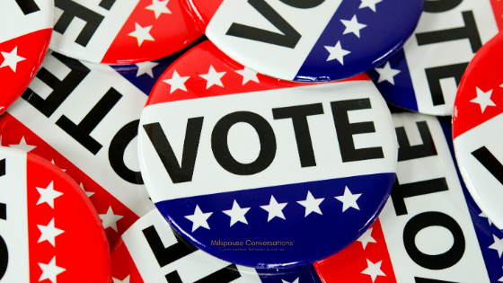 A group of buttons with the word vote on them.