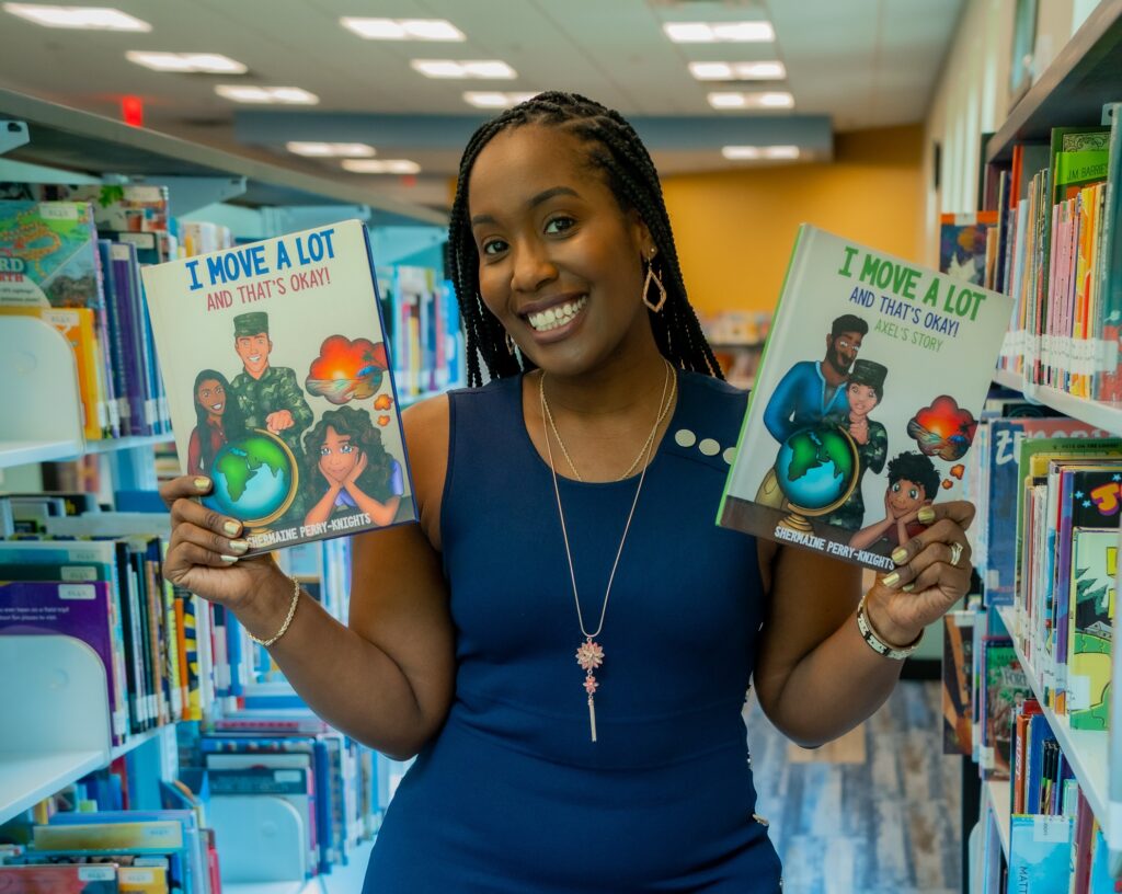 A woman holding two books in her hands.