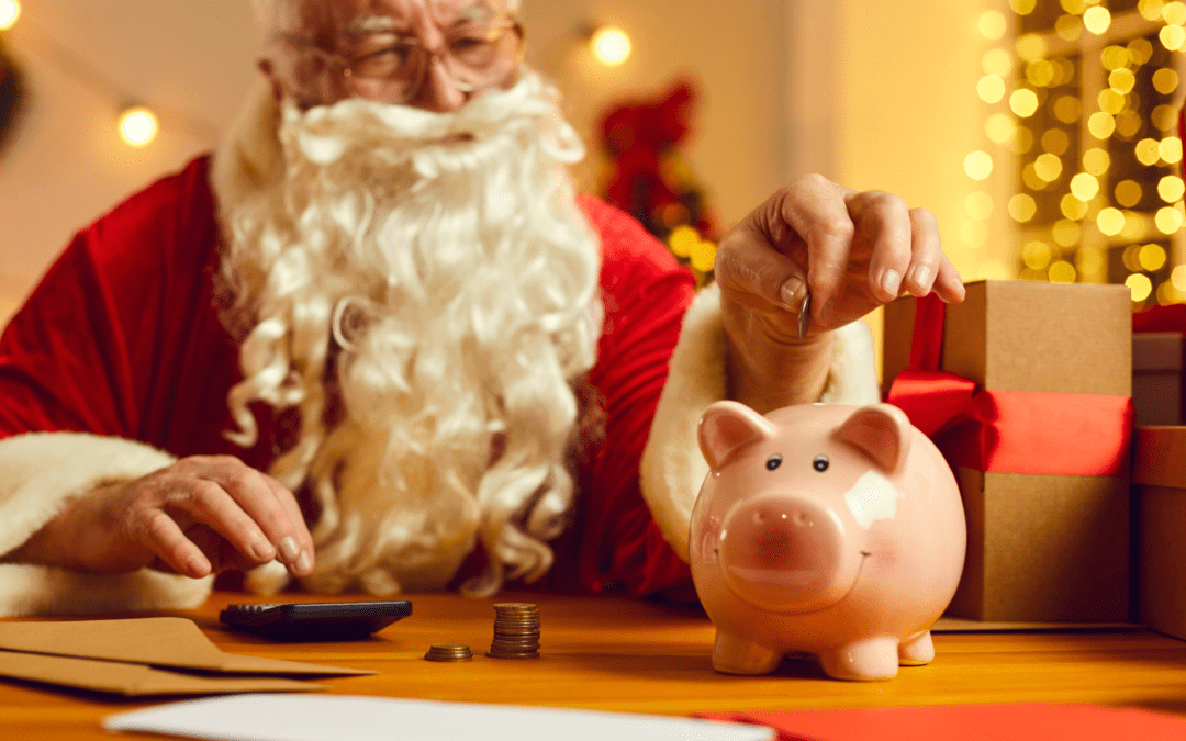 Santa claus putting money into a piggy bank.